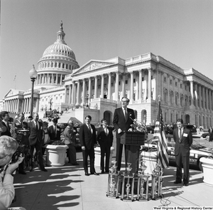 ["Senator John D. (Jay) Rockefeller speaks at a clean vehicle event outside the Senate."]%