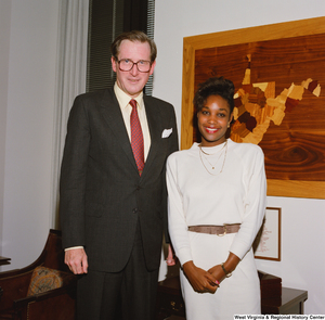 ["Senator John D. (Jay) Rockefeller stands next to one of his interns."]%