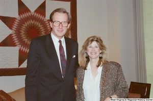 ["Senator John D. (Jay) Rockefeller stands next to an unidentified woman in his office."]%