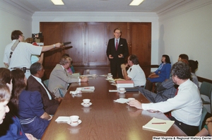 ["Senator John D. (Jay) Rockefeller speaks to a group of people seated at a long-term care hearing."]%