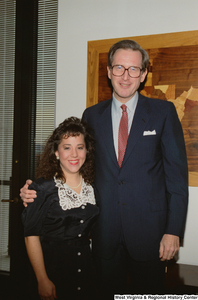 ["Senator John D. (Jay) Rockefeller with a young woman visiting his office."]%