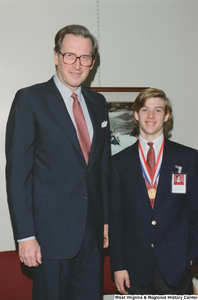 ["Senator John D. (Jay) Rockefeller stands beside one of the West Virginia participants in the United States Senate Youth Program."]%