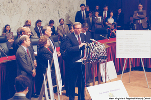 ["Senator John D. (Jay) Rockefeller stands behind a set of microphones at a Pepper Commission press event."]%