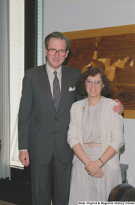 ["Senator John D. (Jay) Rockefeller stands beside an unidentified woman."]%