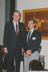 ["Senator John D. (Jay) Rockefeller stands next to a visiting student from West Virginia."]%