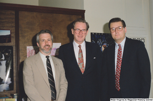 ["Senator John D. (Jay) Rockefeller stands between two representatives from the West Virginia Credit Union League."]%