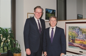 ["Senator John D. (Jay) Rockefeller stands next to an unidentified man in his office."]%