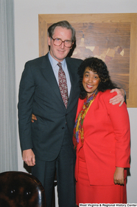 ["Senator John D. (Jay) Rockefeller with a woman in his office."]%