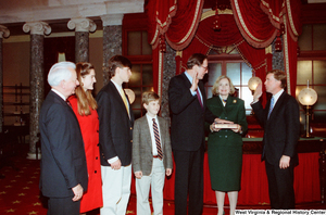 ["Senator John D. (Jay) Rockefeller is sworn in for his second term as Senator from West Virginia. Vice President Dan Quayle administers the oath, Sharon Rockefeller holds the bible, and Senator Robert C. Byrd can be seen standing with Senator Rockefeller's children."]%