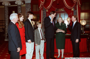 ["Vice President Dan Quayle administers the oath of office to Senator John D. (Jay) Rockefeller as he is sworn in to his second term."]%