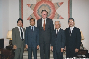 ["Senator John D. (Jay) Rockefeller stands with four men in his Washington office."]%