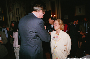 ["Senator John D. (Jay) Rockefeller talks with a doctor at the Celebrating Telemedicine conference."]%