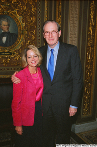 ["Senator John D. (Jay) Rockefeller stands beside an unidentified woman in the President's Room of the United States Senate."]%