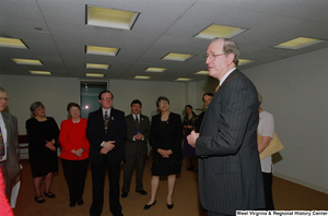 ["Senator John D. (Jay) Rockefeller holds a map titled \"A Salute to 4.1* Million Americans Living Abroad\" as he attends a recognition ceremony hosted by the Federation of American Women's Clubs Overseas."]%