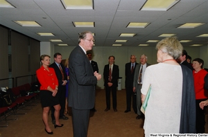 ["Senator John D. (Jay) Rockefeller addresses the group of people attending a recognition ceremony hosted by the Federation of American Women's Clubs Overseas."]%