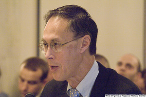 ["An unidentified man testifies at a Senate Select Committee on Intelligence hearing."]%