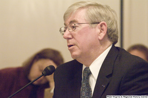 ["An unidentified man testifies before a Senate Select Committee on Intelligence hearing."]%