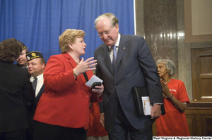 ["Senator John D. (Jay) Rockefeller and Senator Debbie Stabenow talk after a Standing Together for Medicaid press event."]%