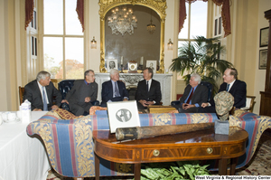 ["Senator John D. (Jay) Rockefeller sits in a room with Senator Ted Kennedy and several other Senators."]%