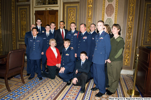 ["President Barack Obama poses for a photograph with members of the Air Force during a visit to the U.S. Capitol Building."]%