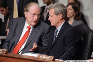 ["Senator John D. (Jay) Rockefeller and Senator Max Baucus chat during an executive session of the Finance Committee to consider health care reform legislation."]%