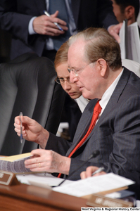 ["Senator John D. (Jay) Rockefeller is briefed by an adviser during an executive session of the Finance Committee on health care reform."]%