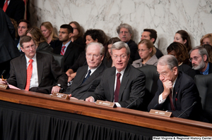 ["Senator John D. (Jay) Rockefeller and other Senators sit during a Finance Committee executive session to consider a health care reform bill."]%