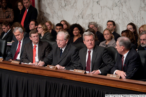 ["A group of Senators sit during a Finance Committee hearing about health care reform."]%