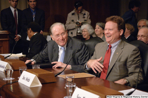 ["Senators John D. (Jay) Rockefeller and Senator Jim Webb laugh during an Energy Committee hearing."]%