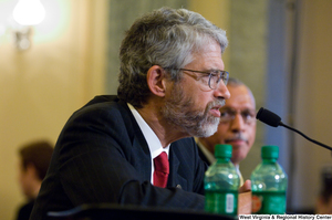 ["An unidentified man testifies at a Commerce Committee hearing."]%