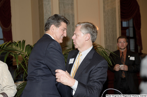 ["Senator Joe Manchin speaks to the press at an event inside the Senate."]%