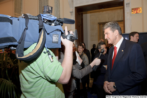 ["Senator Joe Manchin speaks to press at an event in the Senate."]%