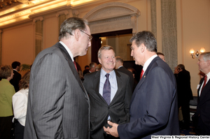 ["Senator Joe Manchin speaks with Senators John D. (Jay) Rockefeller and Max Baucus after his Swearing-In Ceremony."]%