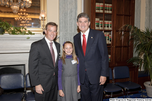 ["Senator Joe Manchin stands with supporters after his swearing-in ceremony."]%