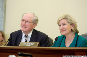 ["Senators John D. (Jay) Rockefeller and Kay Hutchison smile during a Commerce Committee hearing."]%