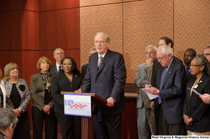 ["Senator John D. (Jay) Rockefeller speaks at a press conference for the National Association of Counties."]%