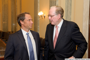 ["Senator John D. (Jay) Rockefeller and Mike Rowe chat after a Senate Commerce Committee hearing."]%