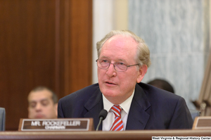 ["Senator John D. (Jay) Rockefeller sits at a Commerce Committee hearing."]%