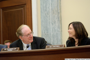 ["Senators John D. (Jay) Rockefeller and Maria Cantwell smile at one another during a Commerce Committee hearing."]%