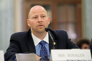 ["A man identified as Mr. Rinaldi testifies before a Senate Commerce Committee."]%