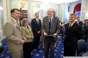 ["Senator John D. (Jay) Rockefeller and Bill Nelson of USA Cares talk before a Senate Commerce Committee hearing."]%