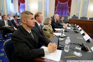 ["Several individuals testify before the Senate Commerce Committee."]%