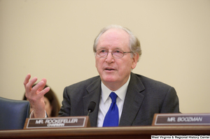 ["Senator John D. (Jay) Rockefeller sits at a Commerce Committee hearing."]%