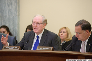 ["Senators John D. (Jay) Rockefeller and John Boozman sit at a Commerce Committee hearing."]%