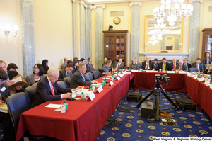 ["Members of the House and Senate join together for a joint Commerce Committee."]%