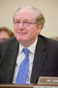 ["Senator John D. (Jay) Rockefeller sits at a Commerce Committee hearing."]%