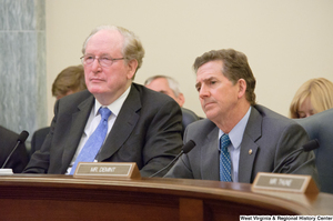 ["Senators John D. (Jay) Rockefeller and Jim DeMint sit at a Commerce Committee hearing."]%