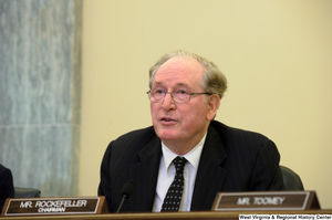 ["Senator John D. (Jay) Rockefeller sits at a Commerce Committee hearing."]%