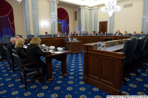 ["This image is of the committee room of a Commerce Committee hearing."]%