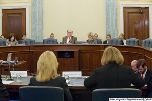 ["This photo from behind the witness bench at a Commerce Committee shows Senators John D. (Jay) Rockefeller and Kay Hutchison sitting in their seats."]%